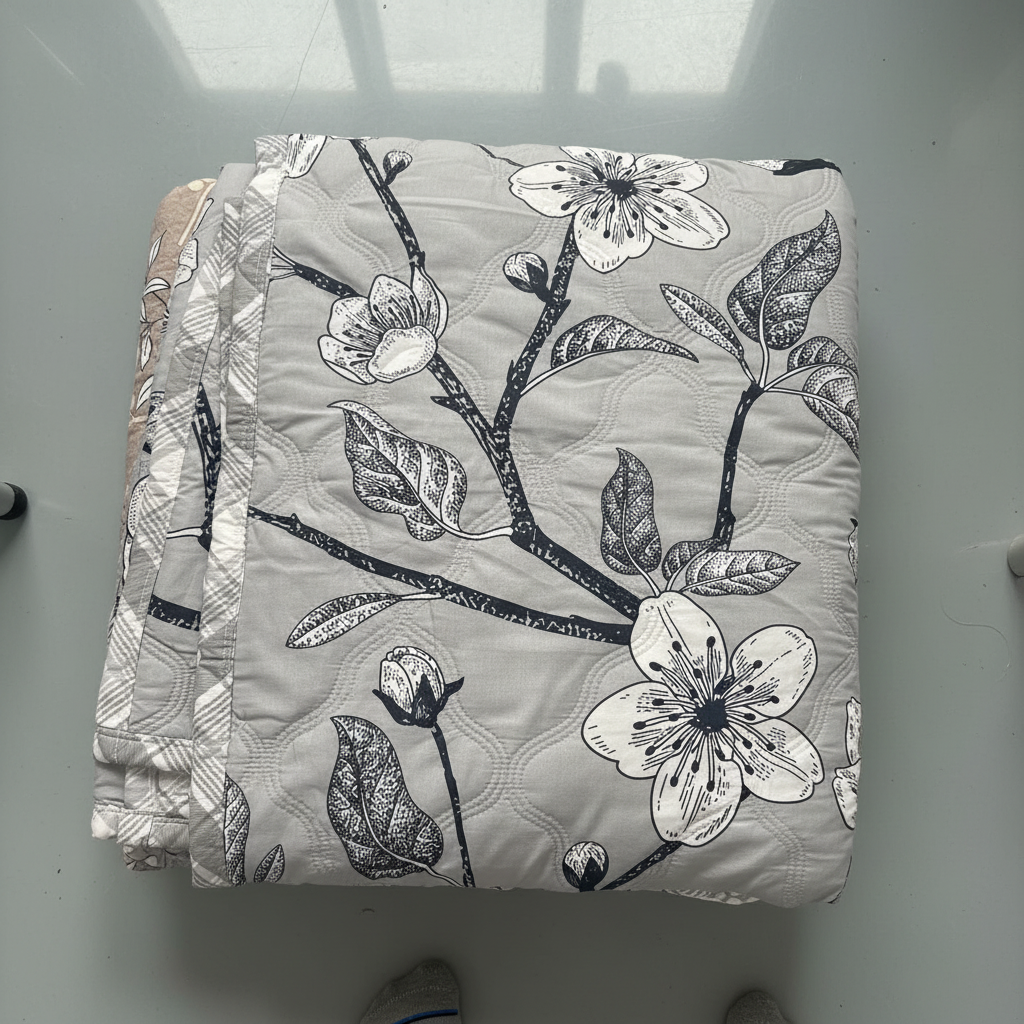 Close-up of Royce Grey Blossom Comforter showing fabric texture and floral print